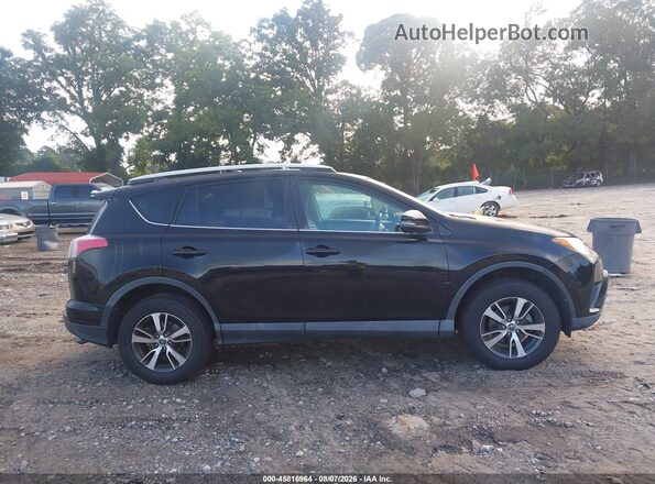 2T3WFREV3GW290029 2016 TOYOTA RAV4 Black Вид задньої частини салону