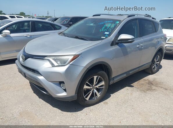 2T3WFREV5JW513310 2018 TOYOTA RAV4 Silver Առջևի ձախ երեք քառորդ տեսարան