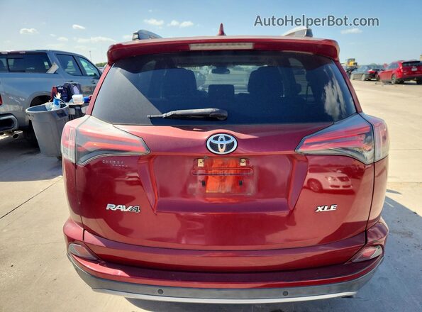 2T3WFREV7JW460044 2018 TOYOTA RAV4 Red Rear view