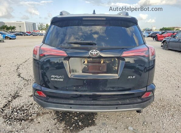 2T3WFREV7JW517682 2018 TOYOTA RAV4 Black Rear view