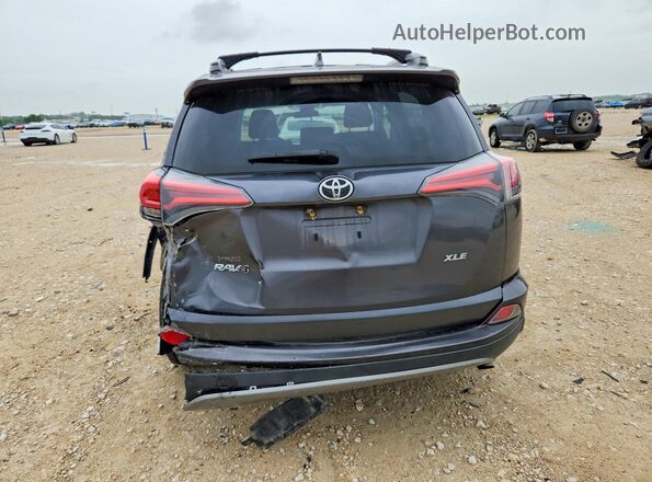 2T3WFREV8HW389804 2017 TOYOTA RAV4 Gray Vista trasera