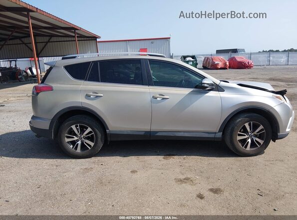 2T3WFREV9GW283876 2016 TOYOTA RAV4 Silver Vista interior trasera