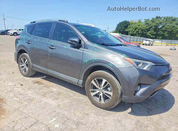 2T3WFREV9JW516145 2018 TOYOTA RAV4 Gray Front right