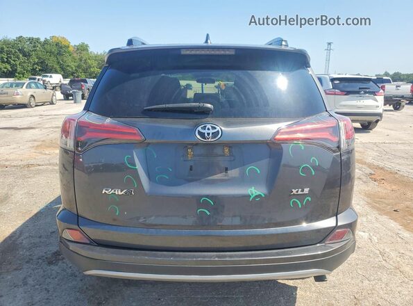 2T3WFREV9JW516145 2018 TOYOTA RAV4 Gray Rear view