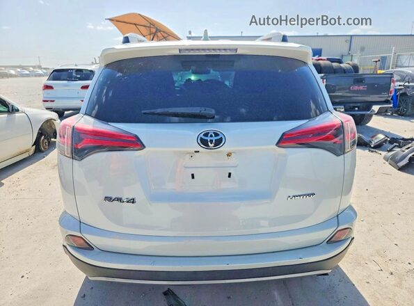 2T3YFREV2JW435819 2018 TOYOTA RAV4 White Rear view