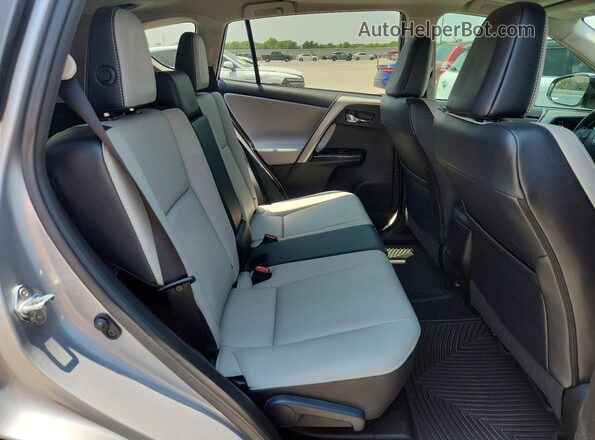 2T3YFREV4HW325929 2017 TOYOTA RAV4 Silver Rear seats view
