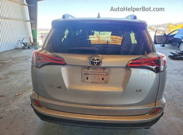 2T3ZFREV2GW291959 2016 TOYOTA RAV4 Серебряный Вид сзади
