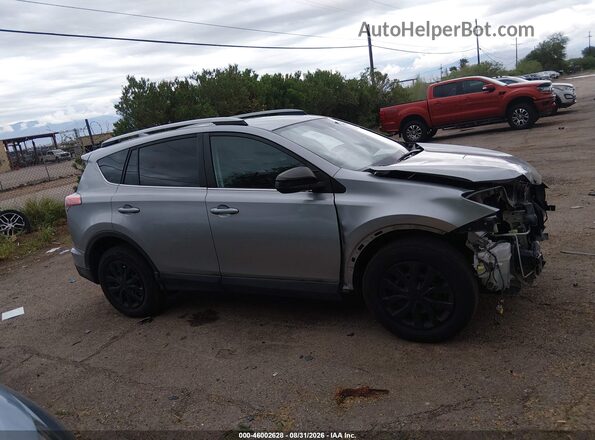2T3ZFREV3JW416880 2018 TOYOTA RAV4 Silver უკანა სალონის ხედი