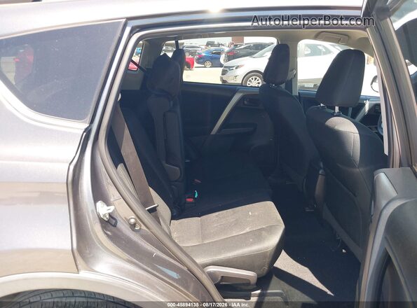 2T3ZFREV3JW456778 2018 TOYOTA RAV4 Gray VIN կոդի պիտակի տեսք