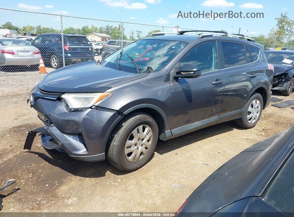 2T3ZFREV4GW282132 2016 TOYOTA RAV4 Gray Przód lewy