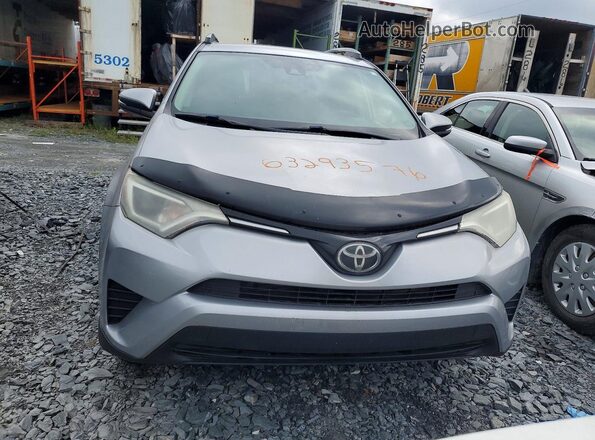 2T3ZFREV4HW324719 2017 TOYOTA RAV4 Silver Front view