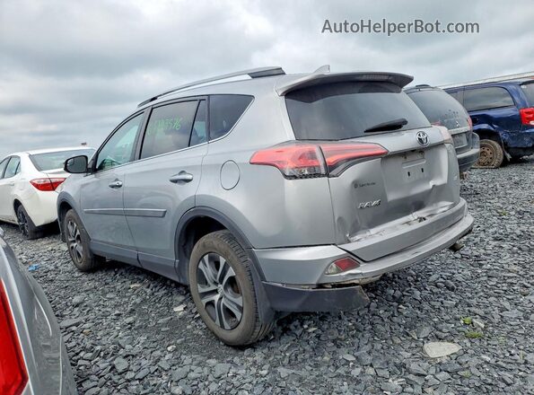 2T3ZFREV4HW324719 2017 TOYOTA RAV4 Silver Rear left
