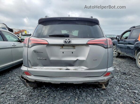 2T3ZFREV4HW324719 2017 TOYOTA RAV4 Silver Rear view