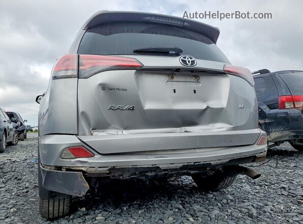 2T3ZFREV4HW324719 2017 TOYOTA RAV4 Silver VIN sticker view