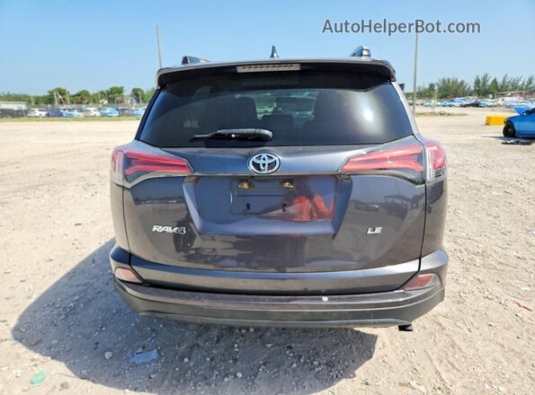 2T3ZFREV6GW240139 2016 TOYOTA RAV4 Gray Rear view