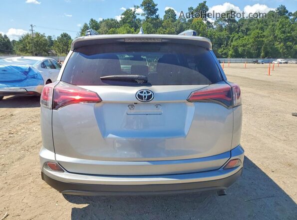2T3ZFREV6HW369676 2017 TOYOTA RAV4 Серебряный Вид сзади