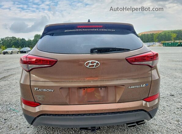 KM8J33A20GU076961 2016 HYUNDAI TUCSON Brown Vista interior delantera
