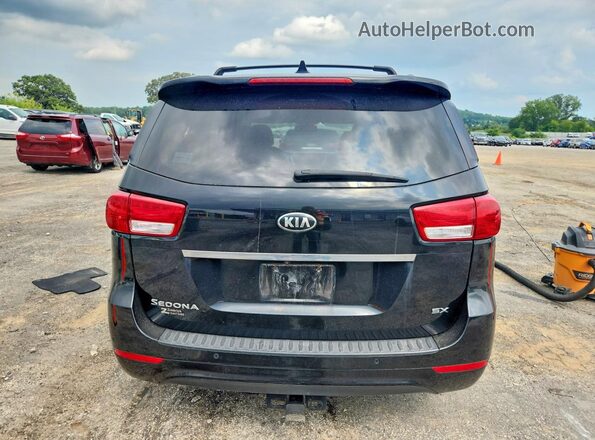 KNDMC5C12G6159054 2016 KIA SEDONA Black Widok wnętrza z przodu