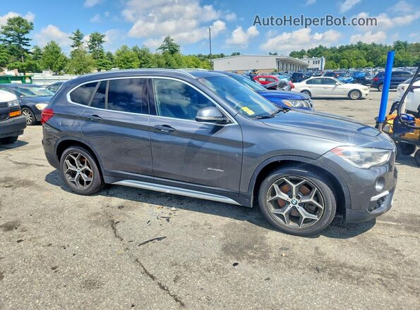 WBXHT3C31GP882429 2016 BMW X1 Gray Front view