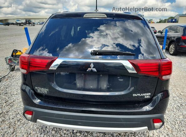 JA4AZ3A34GZ003827 2016 MITSUBISHI OUTLANDER Black Front interior view