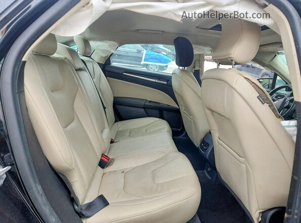 3FA6P0D90JR168176 2018 FORD FUSION Black Vista de los asientos traseros