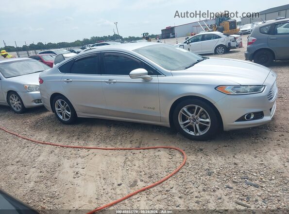 3FA6P0RUXGR296785 2016 FORD FUSION HYBRID Серебряный Вид задней части салона
