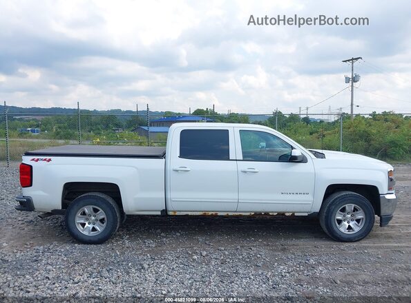 3GCUKREC1JG405008 2018 CHEVROLET SILVERADO White Widok wnętrza z tyłu