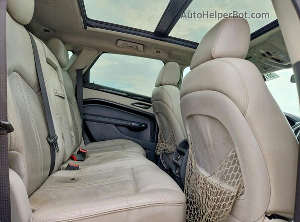 3GYFNBE38GS548433 2016 CADILLAC SRX Серебряный Вид задней части салона