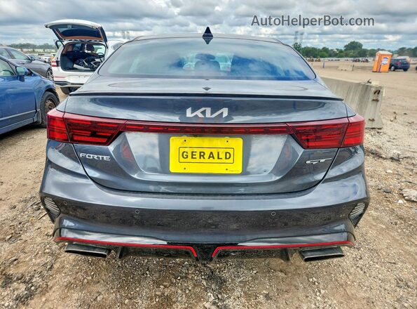3KPF44AC1PE581945 2023 KIA FORTE Gray Widok z tyłu