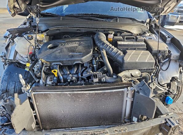 3KPF44AC2PE589567 2023 KIA FORTE Серебряный Вид задней части салона