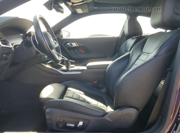 3MW53CM02N8C61584 2022 BMW M2 Purple Front interior view