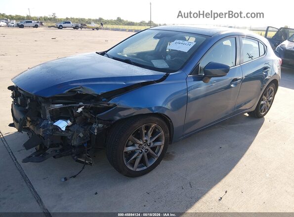 3MZBN1L38JM269686 2018 MAZDA 3 Light Blue Առջևի ձախ երեք քառորդ տեսարան