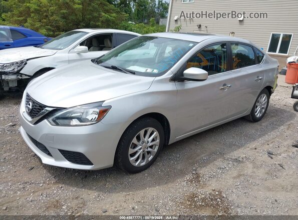 3N1AB7AP7JY215923 2018 NISSAN SENTRA Silver Vista tres cuartos delantera izquierda