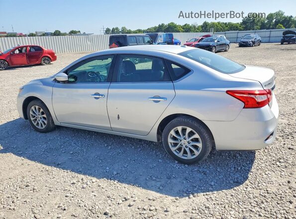 3N1AB7AP8KL610482 2019 NISSAN SENTRA Серебряный Задняя левая четверть