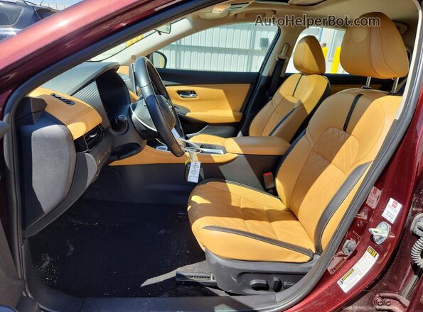 3N1AB8CV6PY245683 2023 NISSAN SENTRA Бордовый Вид салона спереди