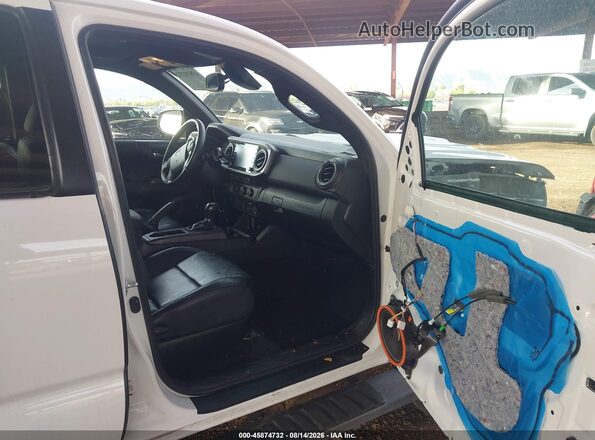 3TMAZ5CN0PM219336 2023 TOYOTA TACOMA Белый Вид салона спереди