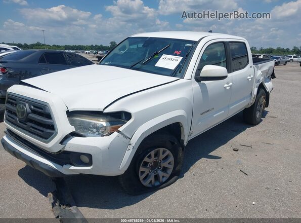 3TMAZ5CN9KM085080 2019 TOYOTA TACOMA White Vista tres cuartos delantera izquierda