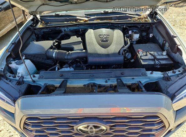 3TMCZ5AN0PM575944 2023 TOYOTA TACOMA Бежевый Вид задней части салона
