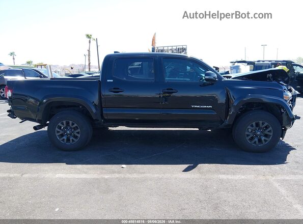 3TMCZ5AN3PM648952 2023 TOYOTA TACOMA Черный Вид задней части салона