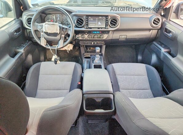 3TMCZ5AN4PM557883 2023 TOYOTA TACOMA Silver Dashboard view