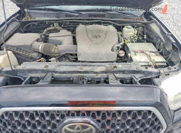 3TMCZ5AN5KM229977 2019 TOYOTA TACOMA Черный Вид задней части салона