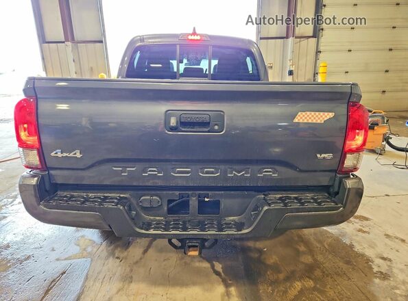 3TMCZ5AN8PM569289 2023 TOYOTA TACOMA Gray Vista trasera