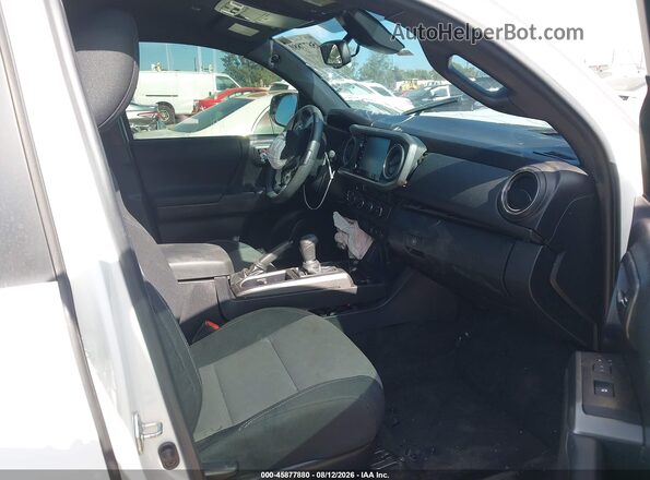 3TMDZ5BN6PM158864 2023 TOYOTA TACOMA Белый Вид салона спереди