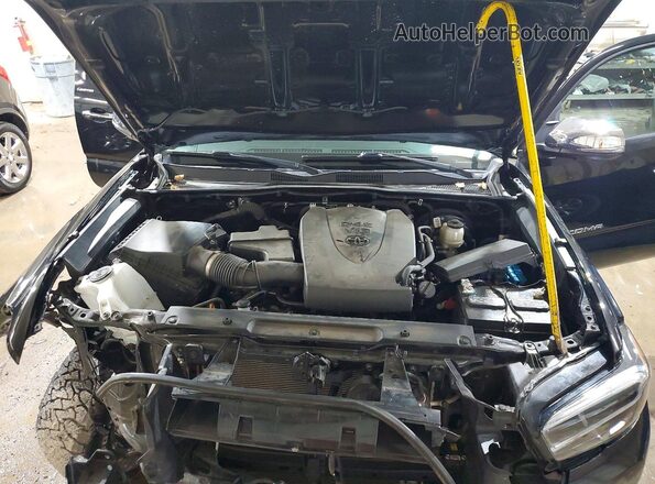 3TMEZ5CN7PM211610 2023 TOYOTA TACOMA Black Вид задньої частини салону