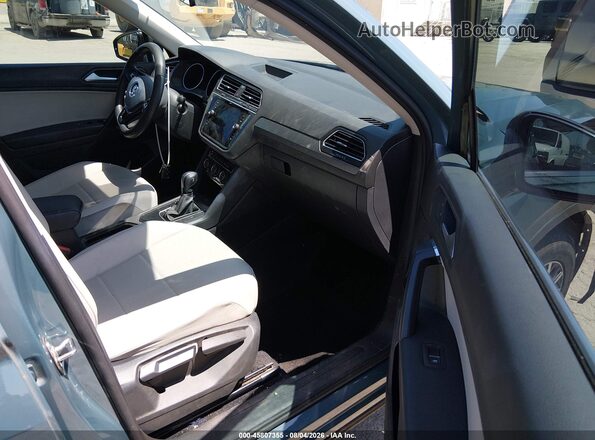 3VV3B7AXXMM050954 2021 VOLKSWAGEN TIGUAN Light Blue Вид салона спереди