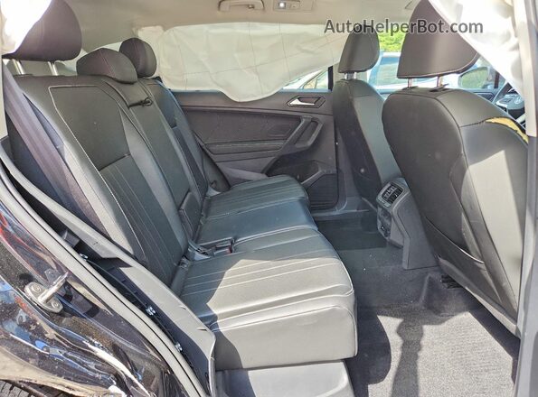 3VVMB7AX1RM074829 2024 VOLKSWAGEN TIGUAN Черный Вид задней части салона