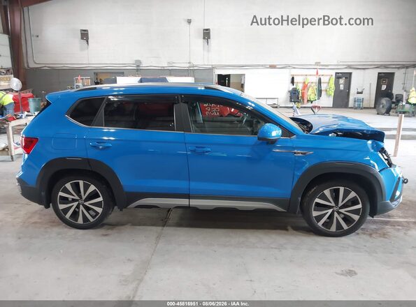3VVSX7B20NM004261 2022 VOLKSWAGEN TAOS Синий Вид задней части салона