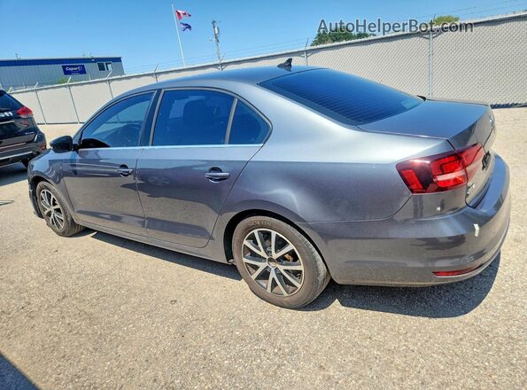 3VWD67AJ9GM369136 2016 VOLKSWAGEN JETTA Gray Trasero izquierdo