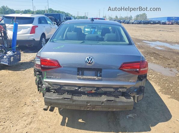 3VWDB7AJ0HM292587 2017 VOLKSWAGEN JETTA Серый Вид сзади