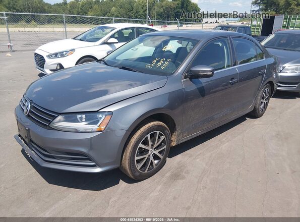 3VWDB7AJ1HM410632 2017 VOLKSWAGEN JETTA Gray Vista tres cuartos delantera izquierda